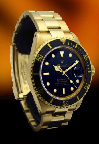 Rolex 16808 Yellow gold Submariner with original black dial